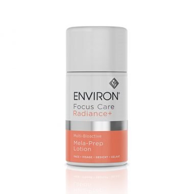 The Environ Focus Care Radiance+ Multi-Bioactive Mela-Prep Lotion comes in a cylindrical product container with a white top and a lower section in a light pink color. The label reads "Environ Focus Care Radiance+ Multi-Bioactive Mela-Prep Lotion" and mentions it is for face, targeting hyper-pigmentation to promote cell renewal and even out skin tone.