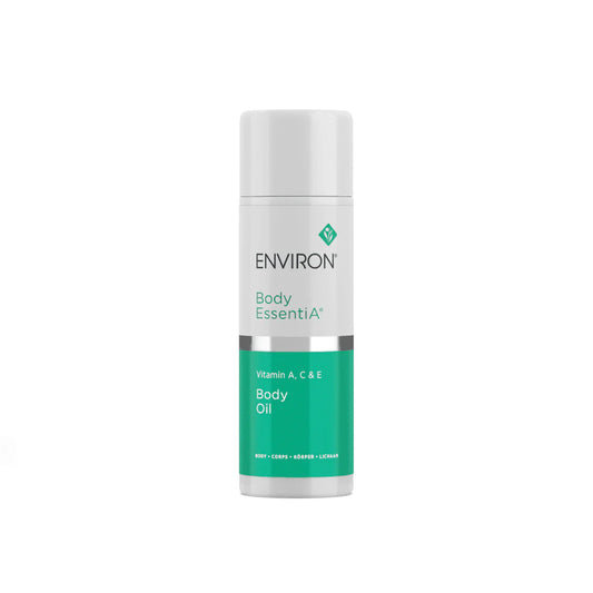 Image of a white cylindrical bottle with a green label containing the text "ENVIRON Environ A, C & E Body Oil." The bottle has a silver cap and a green diamond-shaped logo above the brand name. This nutrient-rich oil is designed for body care, promoting radiant flawless skin.