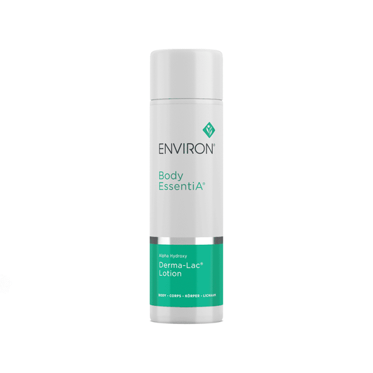 A cylindrical white bottle with a grey lid, labeled "Environ Alpha Hydroxy Derma-Lac Lotion." The lower part of the bottle features a turquoise section with white text detailing the uses of this moisturizing body lotion, which includes combating photo-aging and containing lactic acid for smoother skin.