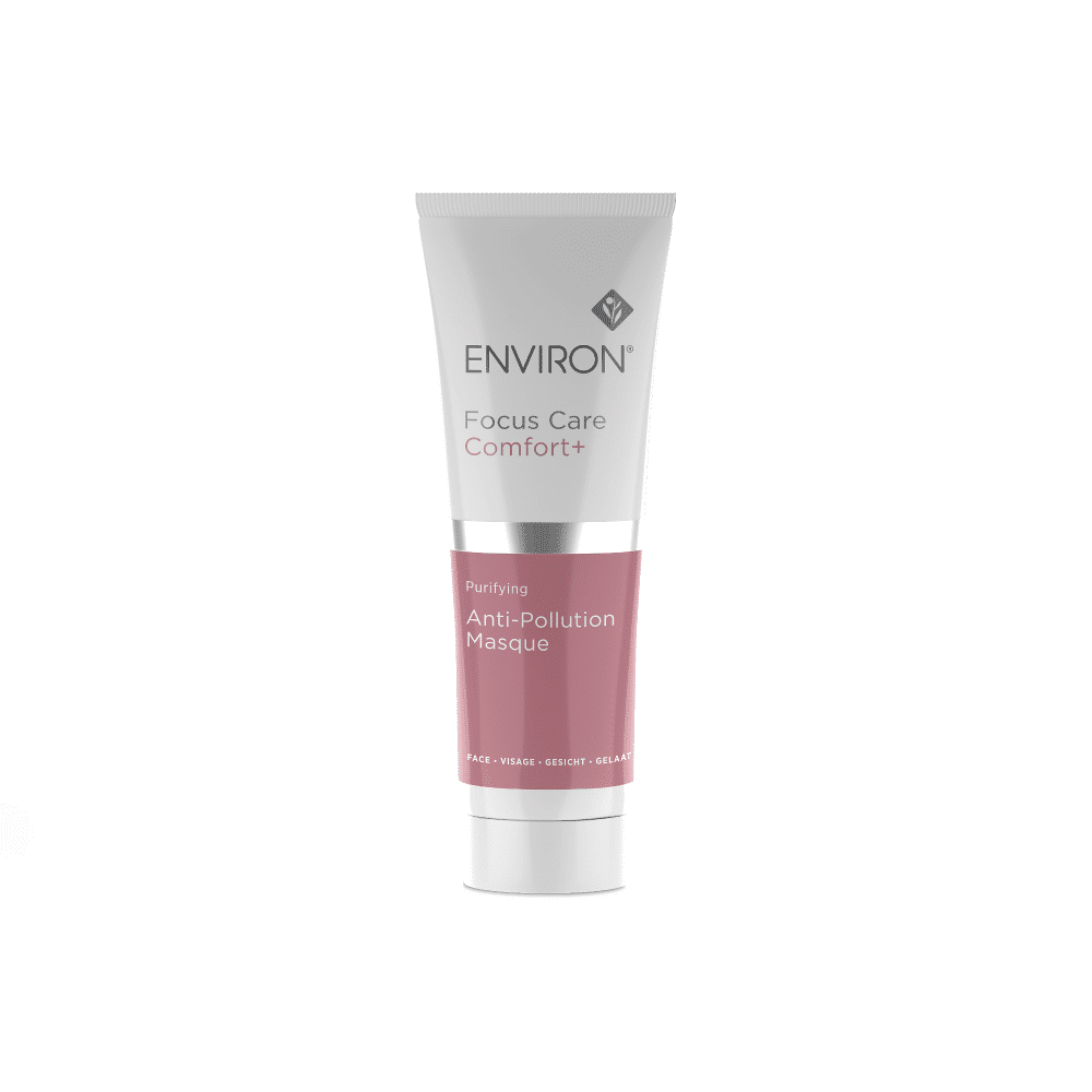 A tube of Environ Comfort+ Purifying Anti-Pollution Masque, designed for facial use. This detoxifying masque features Japanese Charcoal and comes in a mostly white tube with a pink-labeled section. The branding and product information are displayed in gray text.