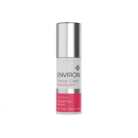 A bottle of Environ Focus Care Moisture+ Hyaluronic Acid Intensive Hydrating Serum with hyaluronic acid. The cylindrical container has a silver cap and a white label with pink accents. "A+ Intensive" and "Hydrating Serum" are highlighted on the label, promising to help reduce fine lines.